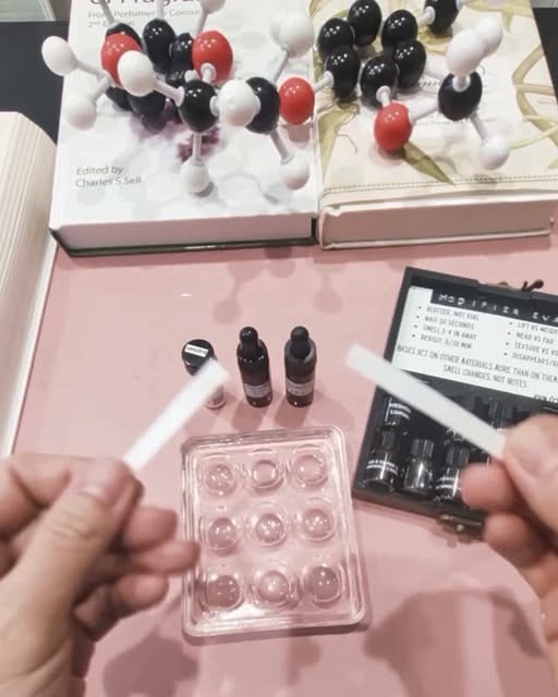 Molecule models, blotters and a tray of vials on Vivian’s desk